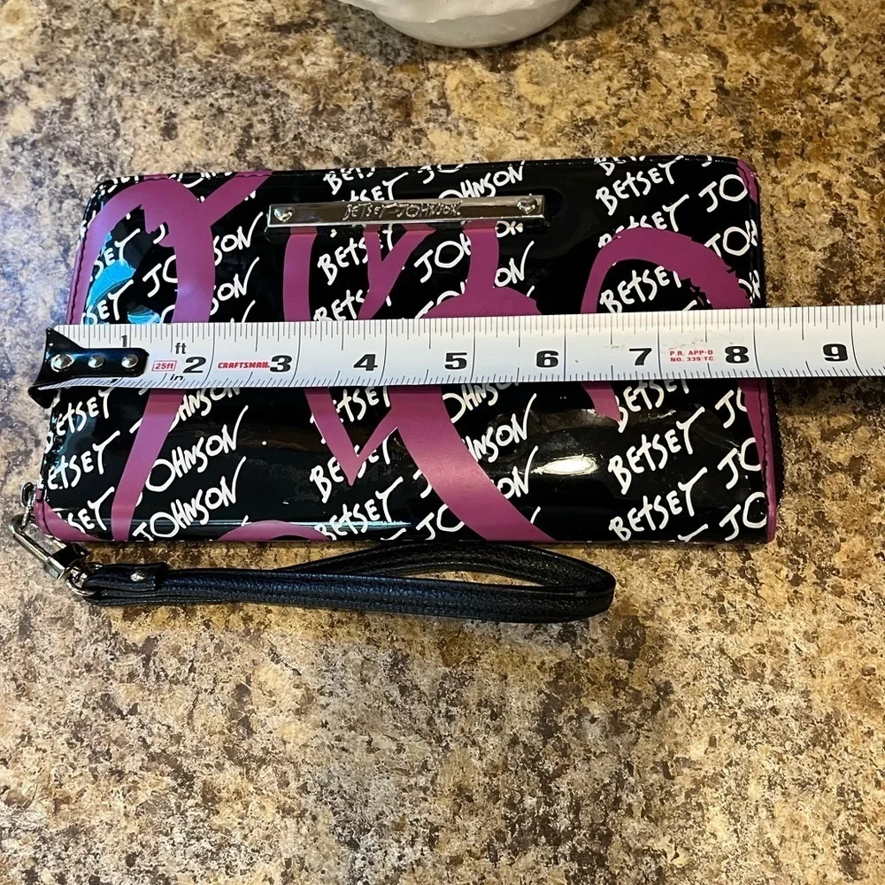 Betsey Johnson Black and Pink Wristlet with Heart Design